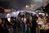 People Standing on Street during Night Time
