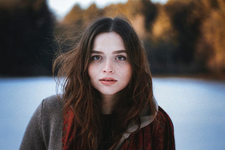 Portrait Of A Pale Brunette Woman Outdoors In Winter 