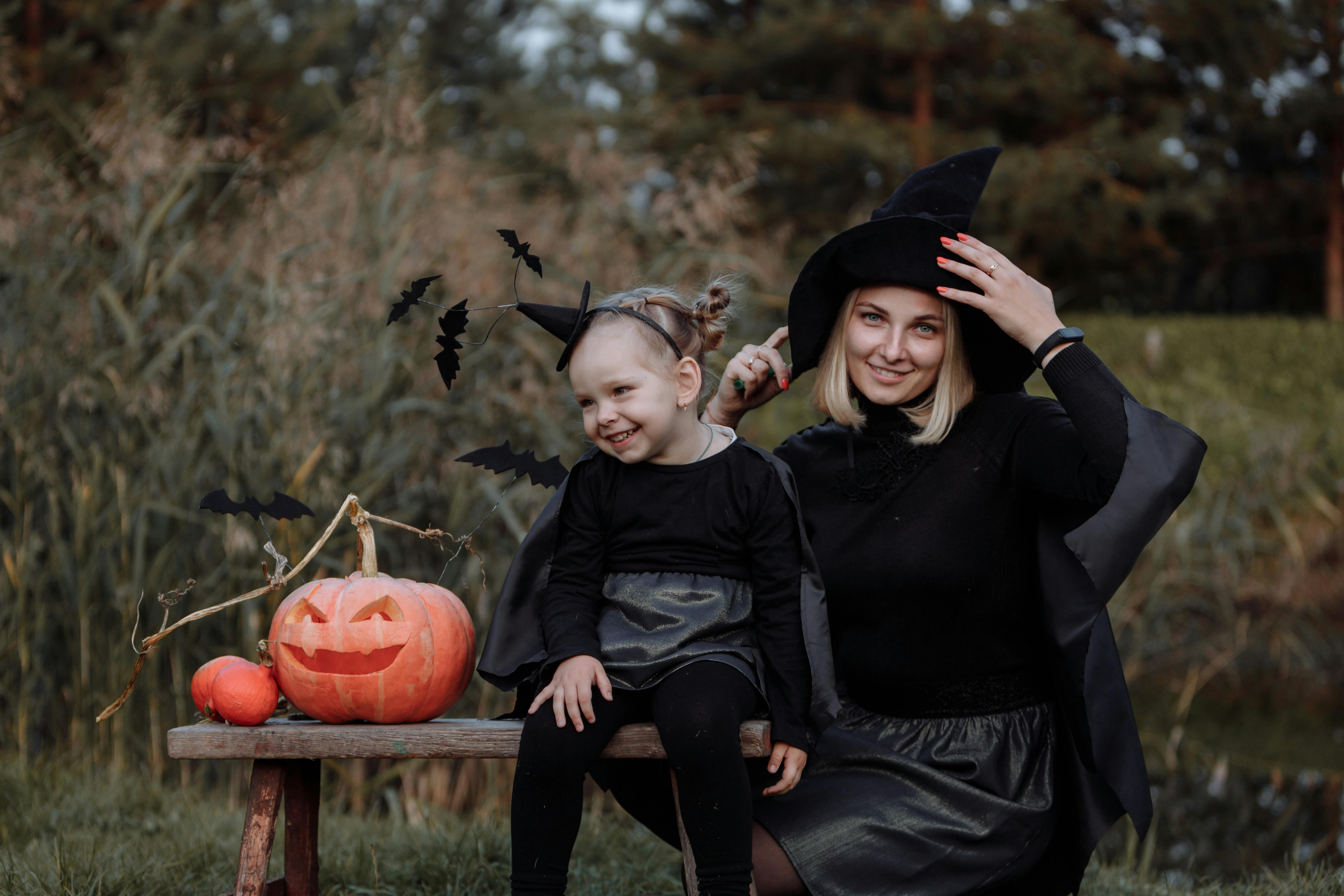 man in black long sleeve shirt sitting beside woman in black long sleeve shirt and black