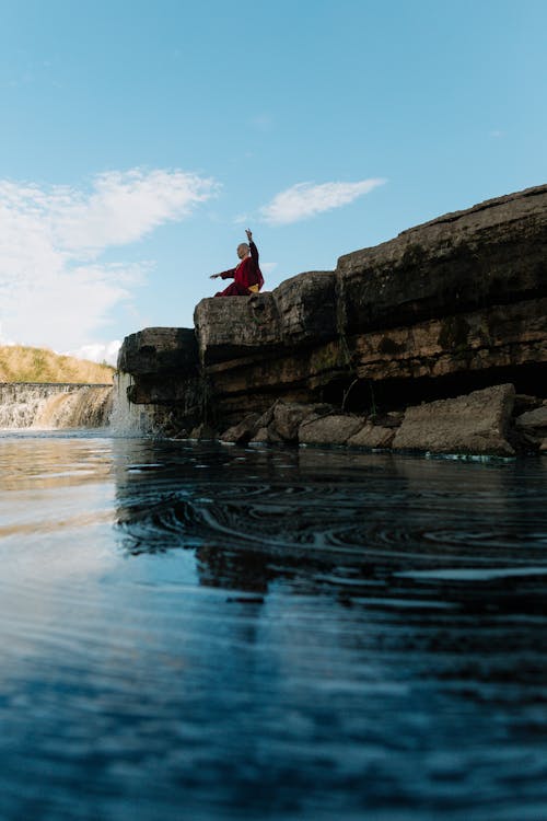 Tibetan Monk Practicing Pranayama on a Rock by the River