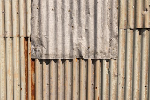 Free Close-up of a Wall Made of Joint Metal Plates  Stock Photo