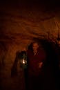 Buddhist Monk with Lantern in a Cave
