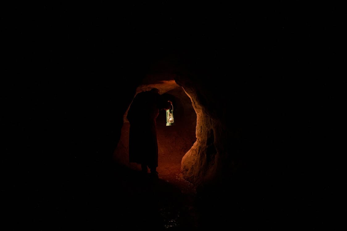 Free Silhouette of Person Inside Cave Stock Photo