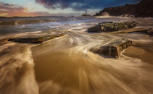 Long Exposure of Water Flowing on the Seashore 