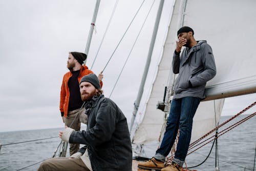 Men in a Boat Sailing the Sea