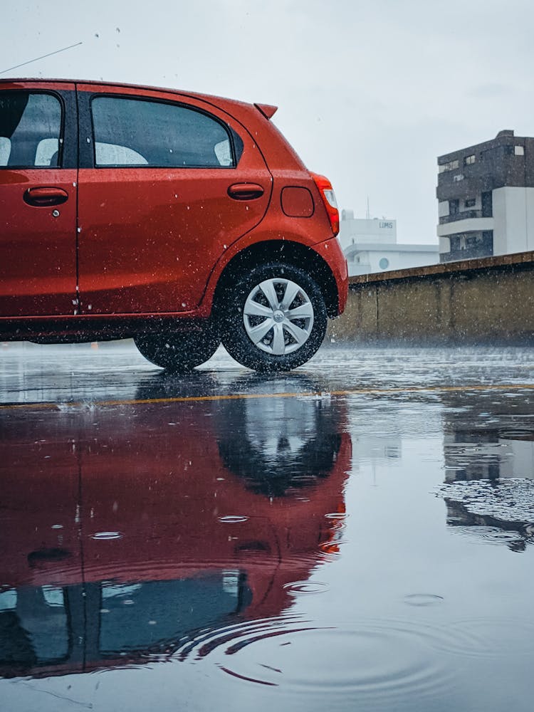 Car On Car Park During Rainfall