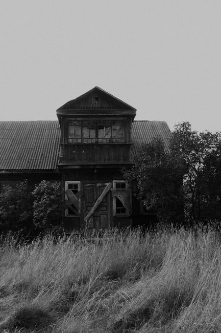 Explore the eerie ambiance of an abandoned farmhouse nestled in the Belarus countryside.