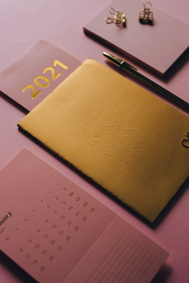 Notebook And Calendar On Pink Background