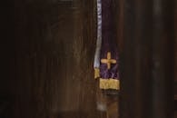 Purple and Gold Textile on Brown Wooden Table