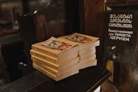 Yellow Books on Brown Wooden Surface