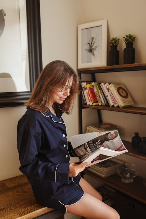 A Woman Looking in the Magazine