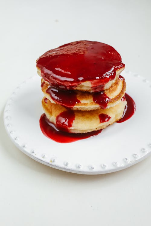 Free Pancakes with Red Syrup Stock Photo