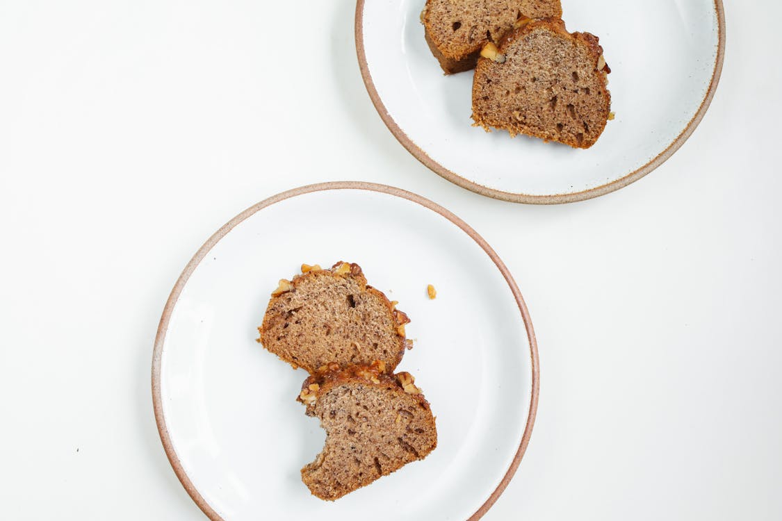 Brown Breads on White Ceramic Plates