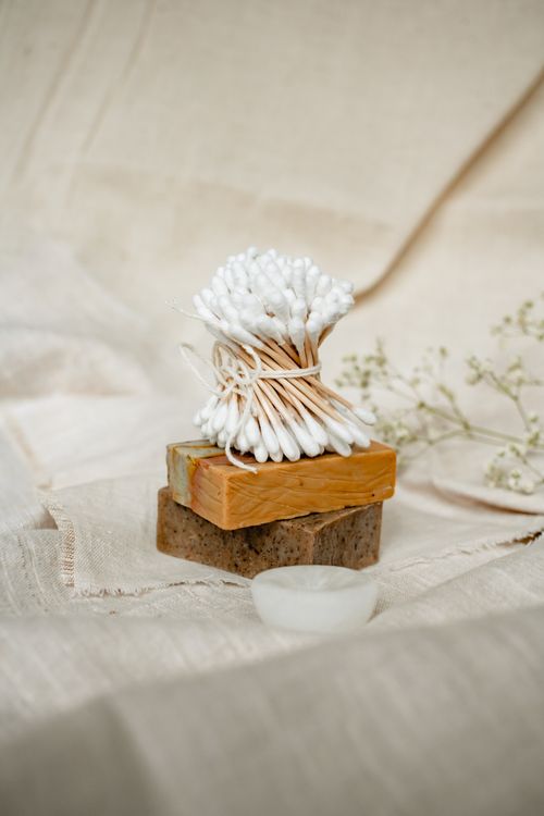 Free Minimalist natural hygiene concept showcasing eco-friendly materials like cotton buds and handmade soap. Stock Photo