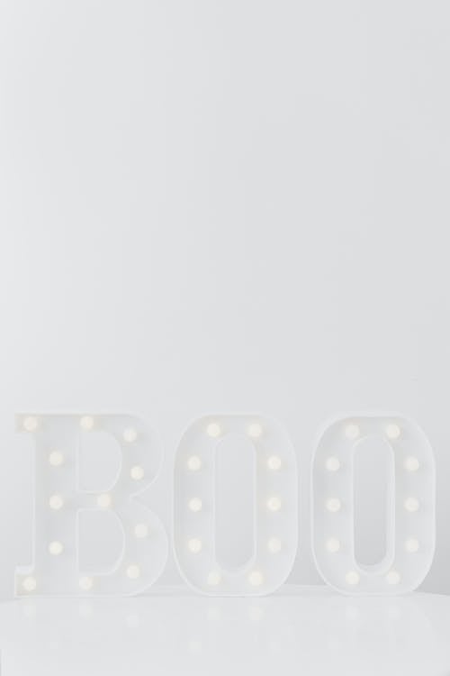 A White Boo Signage on White Background