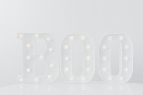 A White Boo Signage on White Background
