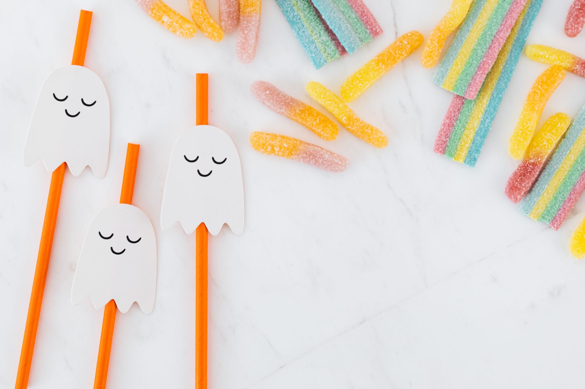 Ghost shaped crispy rice treats on a wire rack