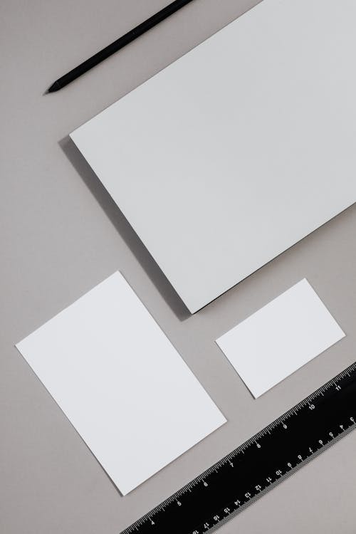 Free Blank Sheets of Paper, Ruler and a Pen Stock Photo
