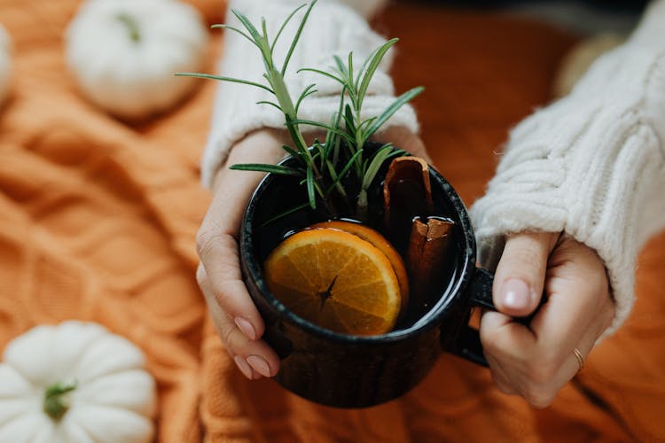 Close Up Of Woman Hands Holding Tea Cup 