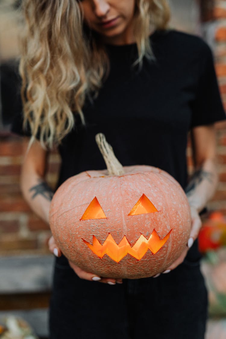 Blonde Girl Holding Pumpkin Lantern