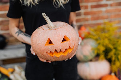 Woman Holding Halloween Pumpkin
