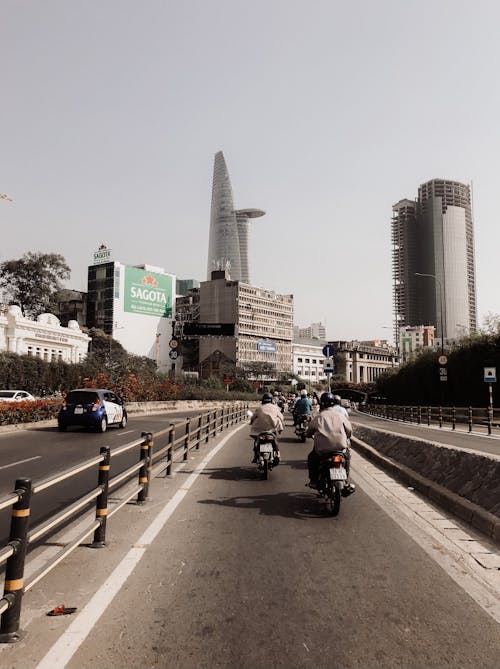 People Riding Motorcycle on Road