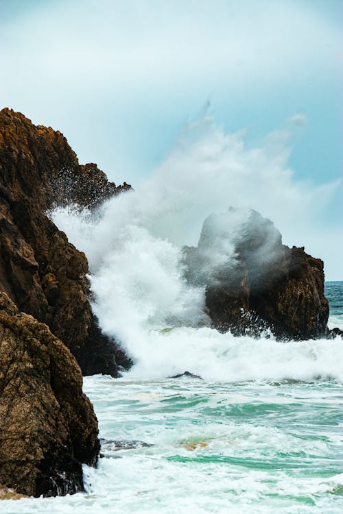 Rocky cliffs washed by powerful waves