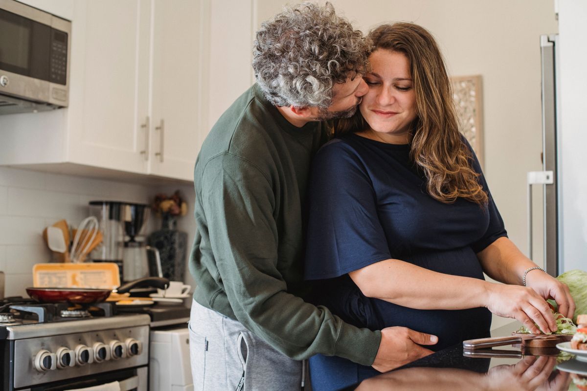 Romantic couple cooking together in the kitchen