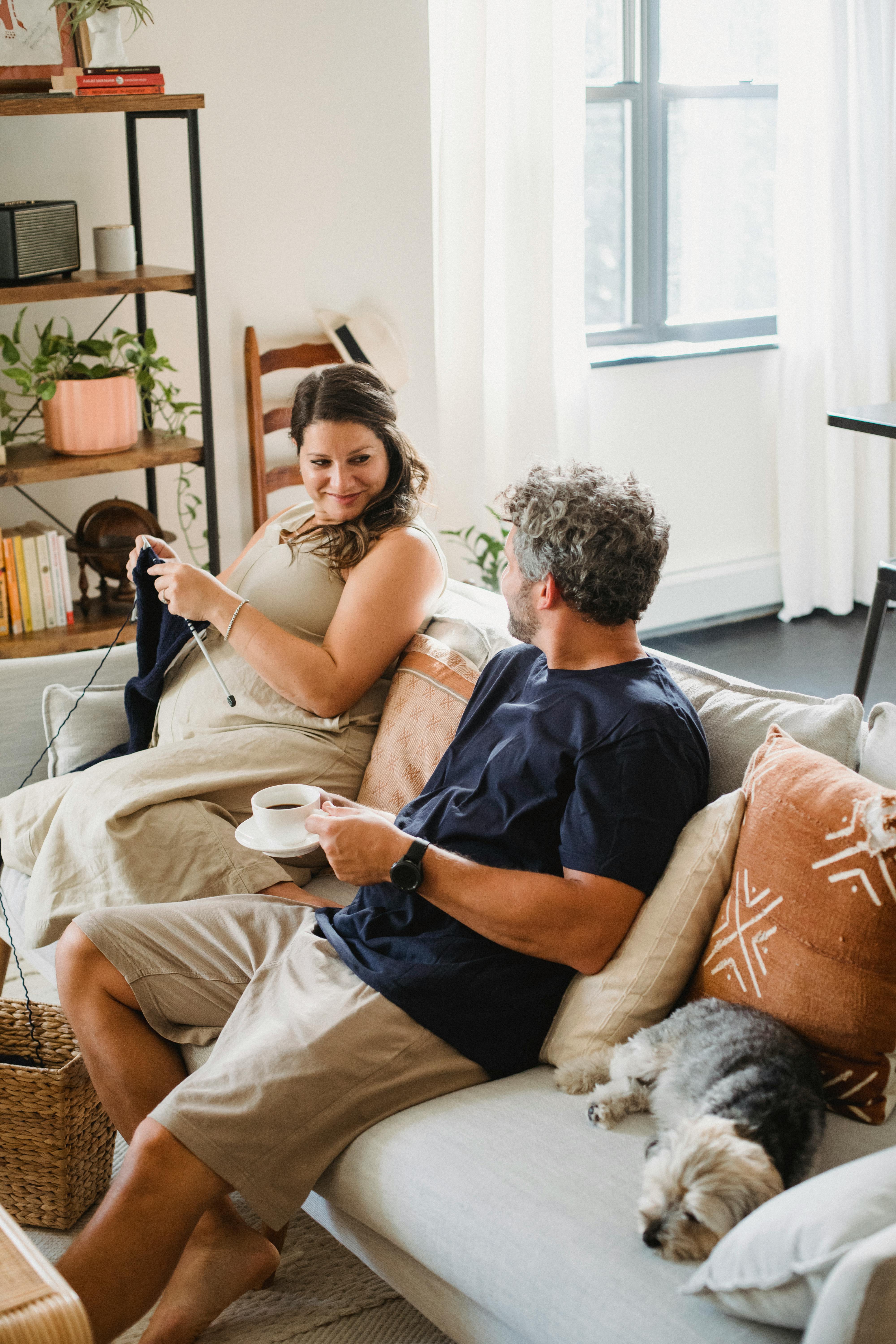 happy couple resting on couch