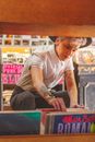 Person in a Music Store Choosing a Record 
