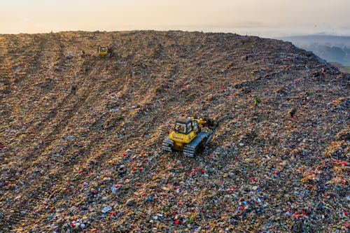 Yellow Heavy Equipment on Landfill 