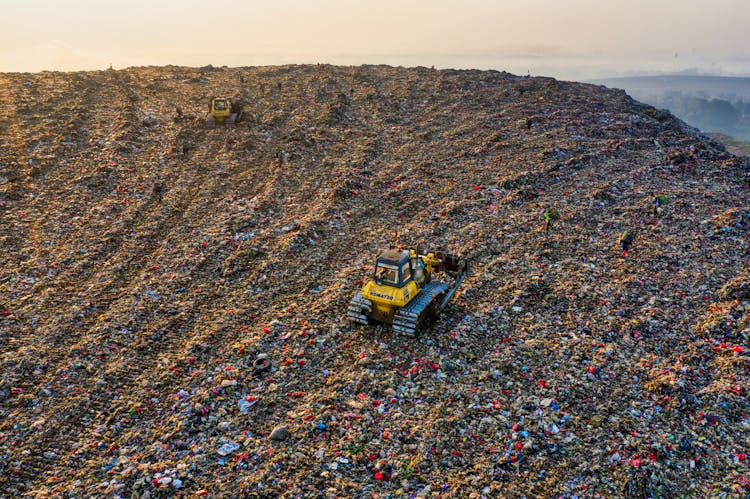 Yellow Heavy Equipment On Landfill 