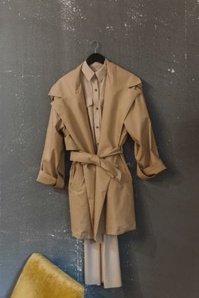 Beige trench coat on a hanger — photo by Arina Krasnikova on Pexels