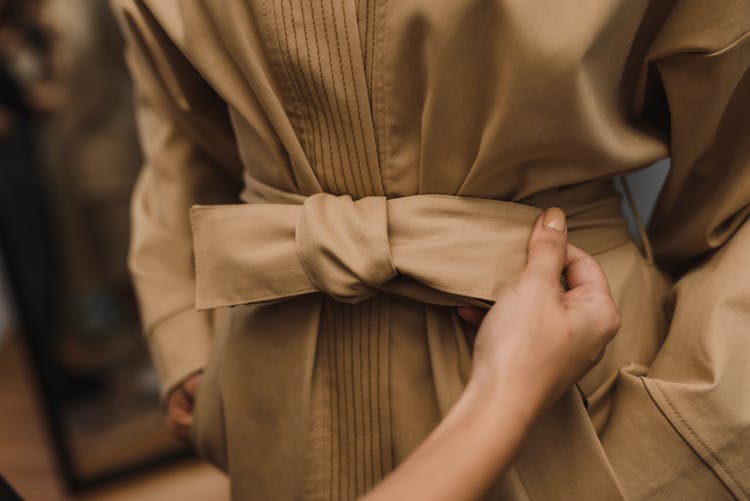 Person Holding Brown Belt