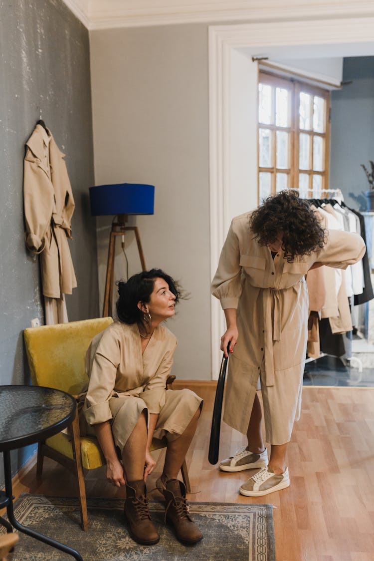 Women Trying On Clothing In A Store 