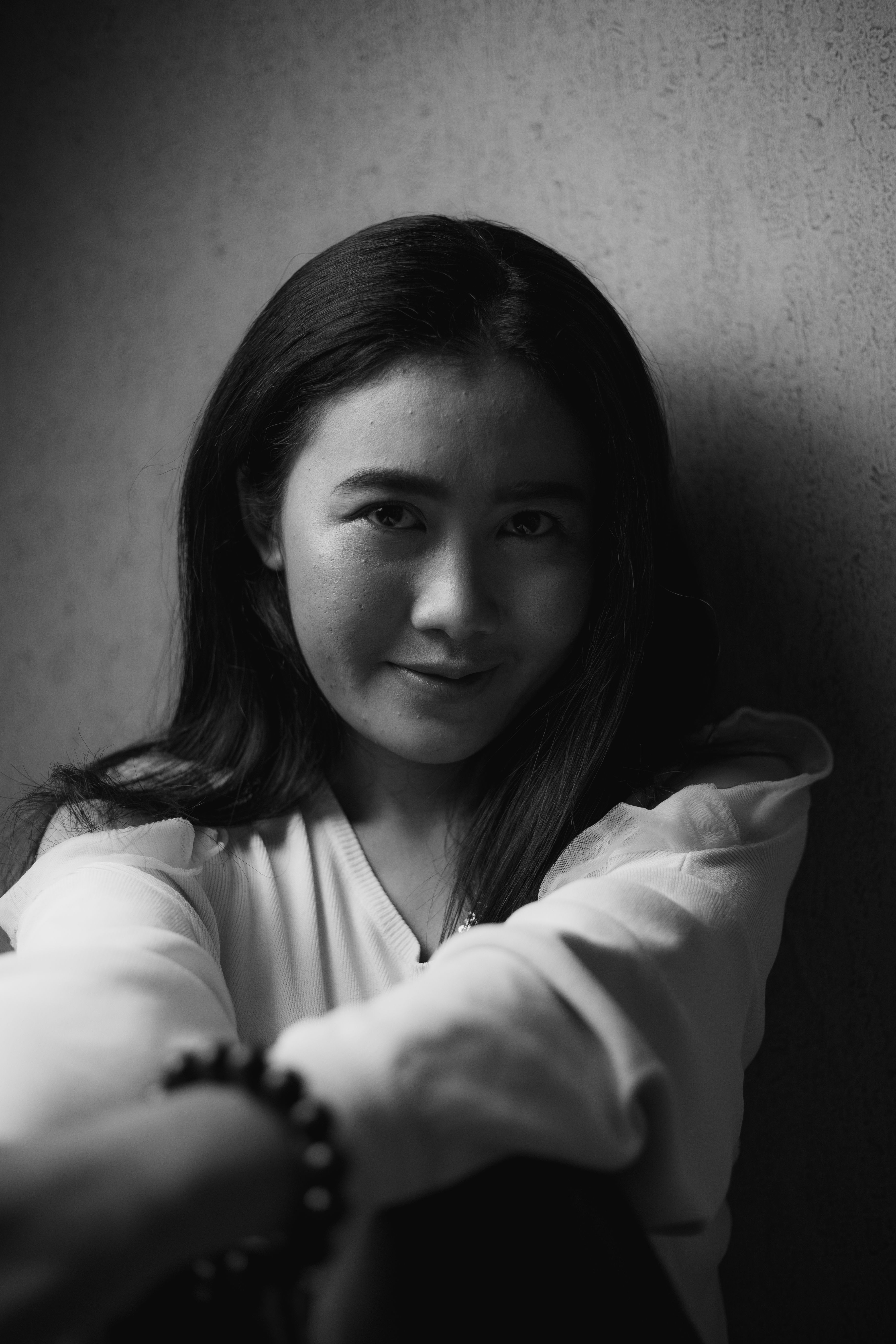 Grayscale Photo of a Woman in Long Sleeve Shirt · Free Stock Photo
