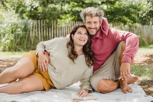 Happy couple having picnic together outside