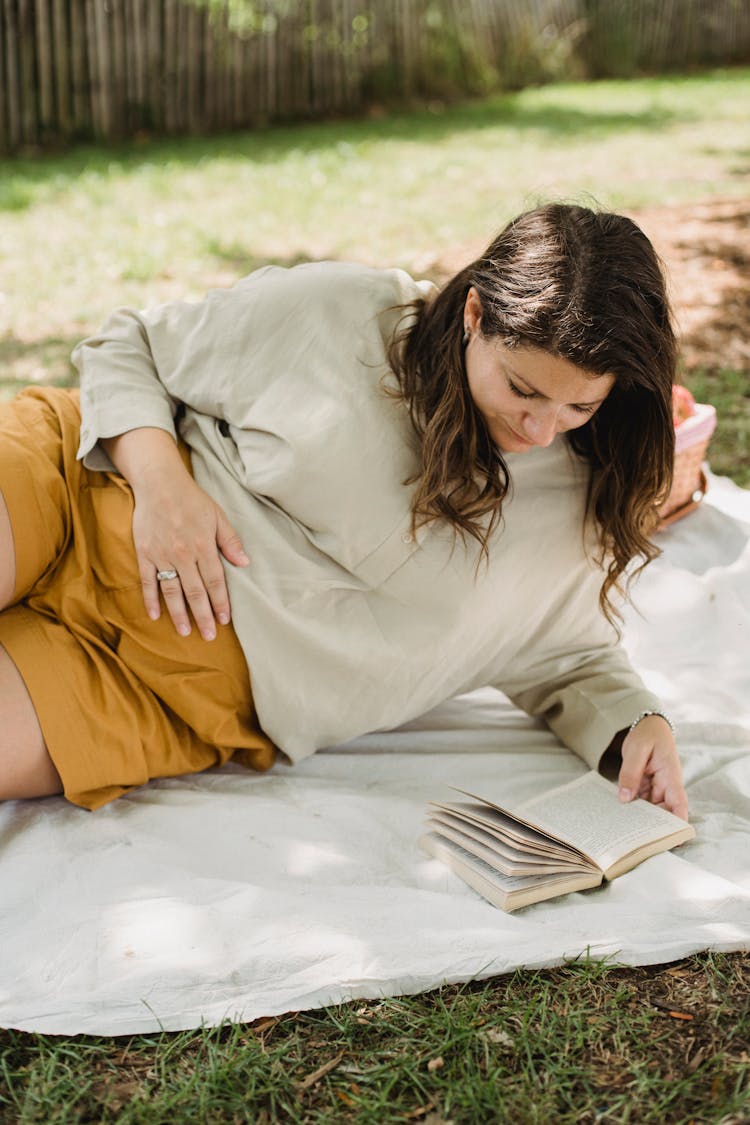 Pregnant Lady Having Picnic In Backyard