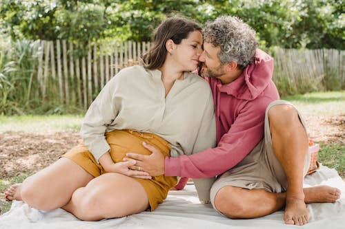 Free Couple having picnic together in backyard Stock Photo