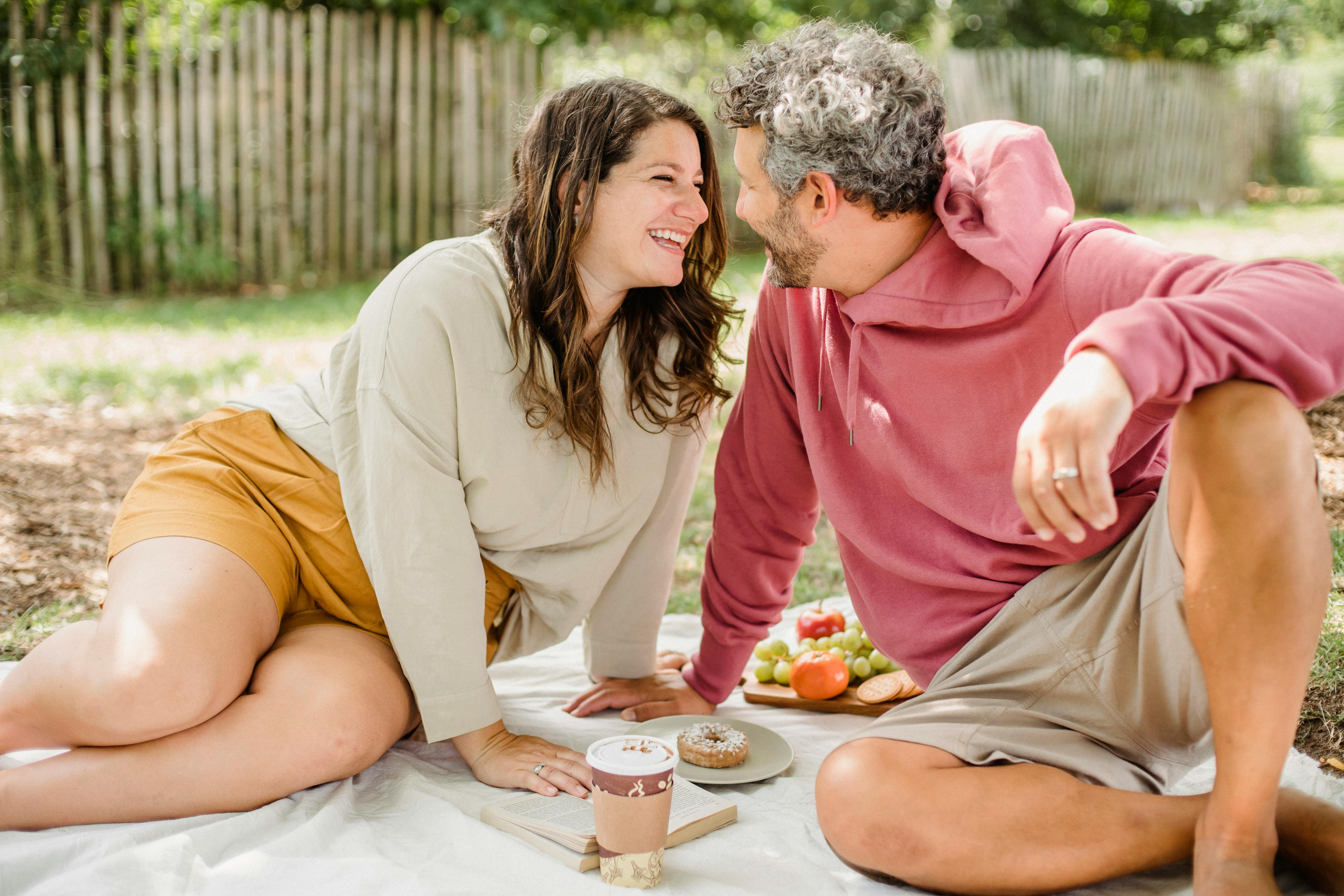 happy couple enjoying picnic together