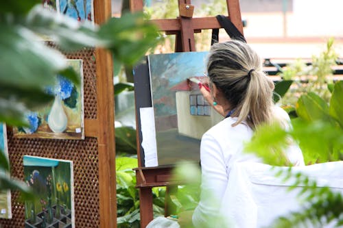 Free Woman Painting Outside Garden Stock Photo