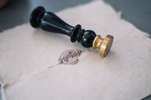 Free Close-up of vintage sealing wax and stamp on an old-fashioned envelope. Stock Photo