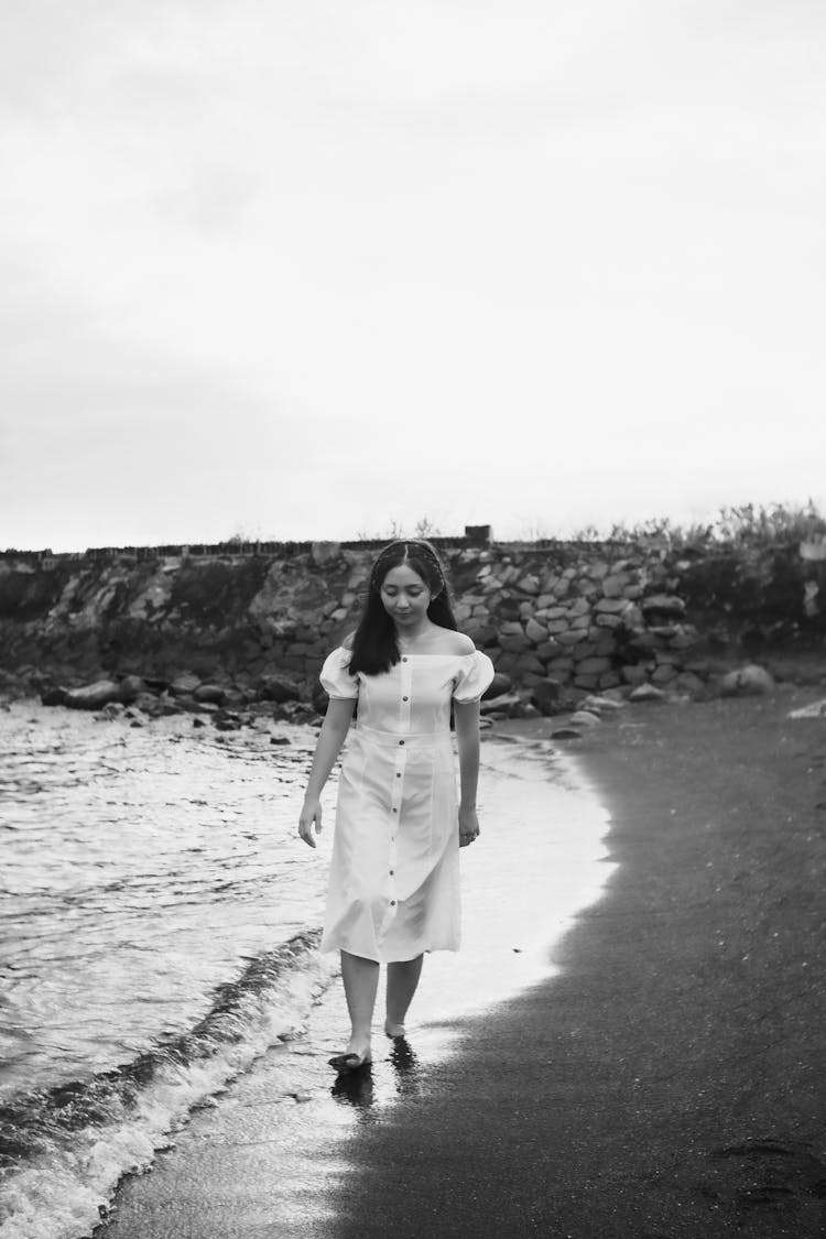 Stylish Asian Teen Walking On Sea Shore