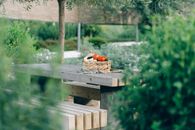 Brown Wooden Table With Orange Tabby Cat on Top