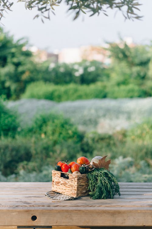 Fresh Vegetables on a Woven Basket on Table Top
