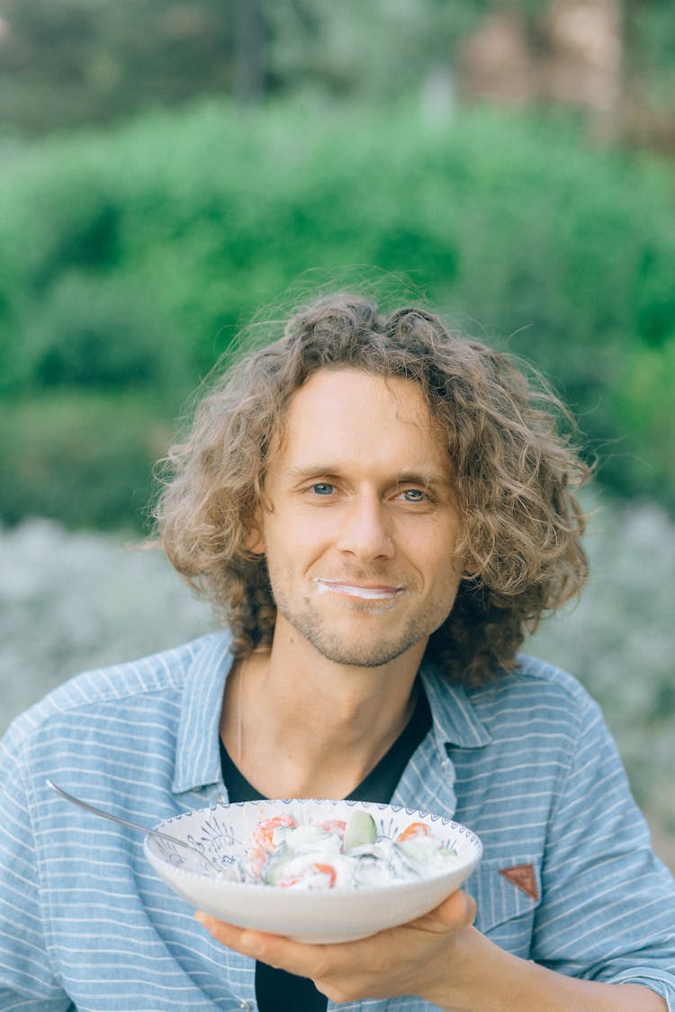 Man Holding A Bowl Of Salad