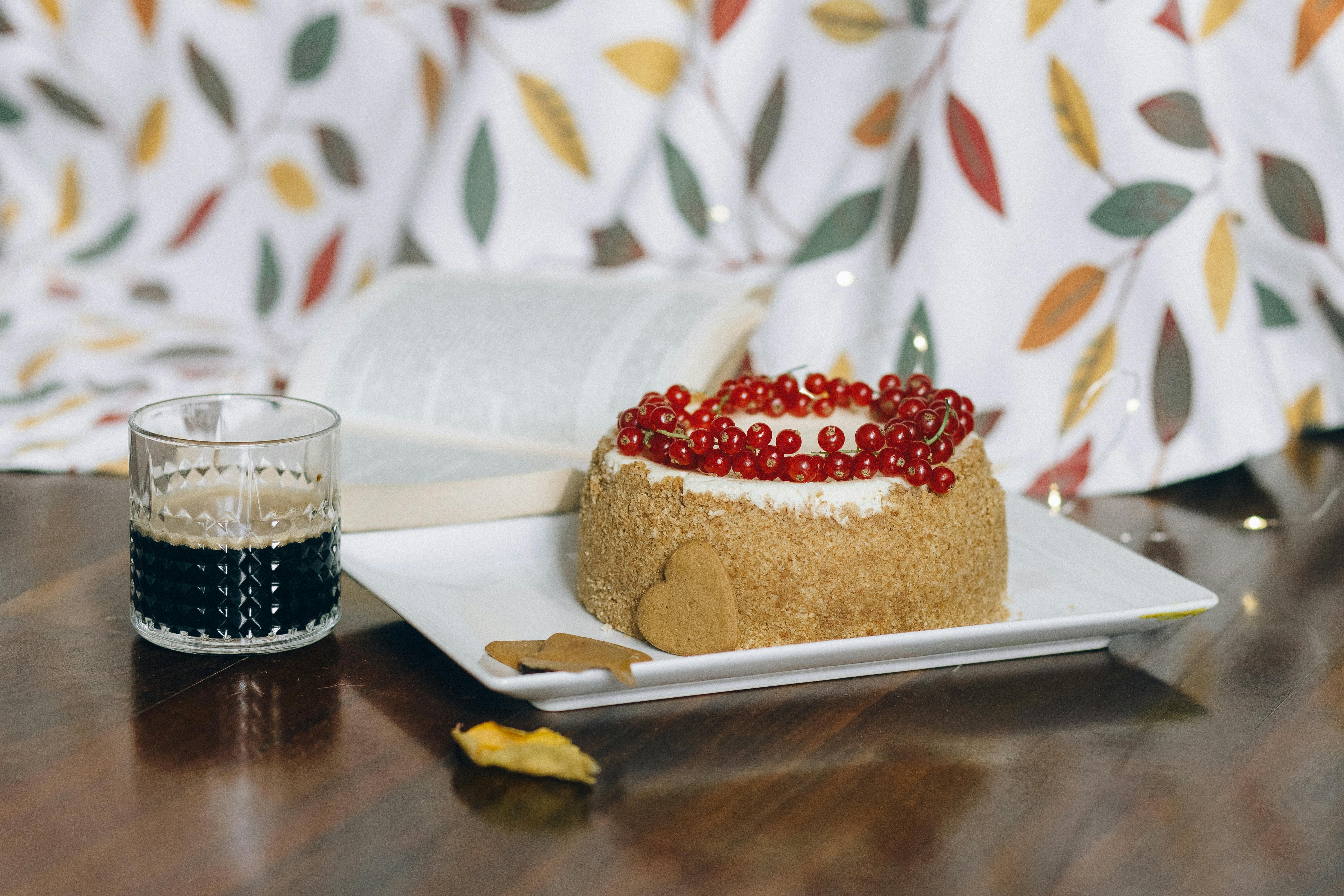 cake with red berries on a platter