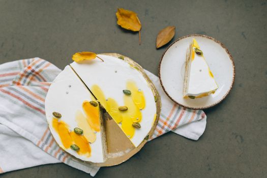 Indulge in a slice of pistachio cake adorned with vibrant yellow glaze, perfect for dessert lovers.
