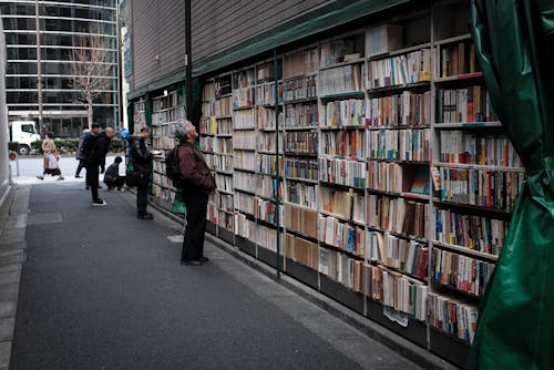 People looking at Book Shelves 