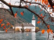 White and Brown Concrete Building Near Body of Water